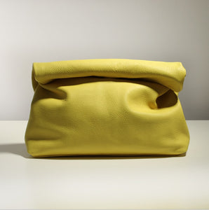 Casual designed yellow clutch bag. Material: Leather. Lining Material: Cotton. Interior: Cell Phone Pocket. Hardness: Soft. Closure Type: Hasp. Closure: zipper. Size: 12.59 x 11.02 inches (32cm x 28 cm). Free shipping.