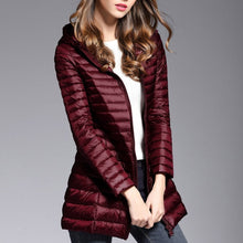 Load image into Gallery viewer, This down jacket will keep you warm this fall and winter. Type: Slim. Thickness: Standard. Style: Casual. Sleeve Length: Full. Material: nylon. Material: Down. Hooded. Filling: White duck down. Fabric Type: Broadcloth. Down Weight: &lt;100g. Down Content: 90%. Clothing Length: Long. Closure Type: zipper. Free Shipping.
