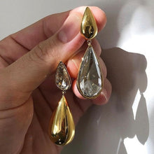 Load image into Gallery viewer, Super stylish earrings that will make your stand out. Material: Brass With 18K Gold layer Zirconia stone earrings. Type: Water Drop Earrings. Item Weight: 0.06 MIU Gold. Free shipping.  
