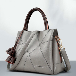 The perfect handbag for you. Number of Handles/Straps: Single. Main Material: PU. Lining Material: Polyester. Interior: Interior Slot Pocket,Cell Phone Pocket,Interior Zipper Pocket,Interior Compartment. Hardness: Hard. Exterior: Silt Pocket. Decoration: Tassel. Closure Type: Zipper. Size: 10.69" x 9.44" x 4.72" (27cm x 24cm x 12 cm).