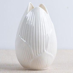This beautiful handmade bone white ceramic vase makes a great gift for yourself or a friend. Style: Modern. Material: ceramic.Features: Easy to clean, corrosion resistant, and sturdy. 