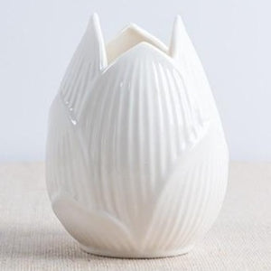 This beautiful handmade ceramic vase makes a great gift for yourself or a friend. Style: Modern. Material: ceramic.Features: Easy to clean, corrosion resistant, and sturdy. Color: Bone White