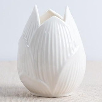 This beautiful handmade ceramic vase makes a great gift for yourself or a friend. Style: Modern. Material: ceramic.Features: Easy to clean, corrosion resistant, and sturdy. Color: Bone White