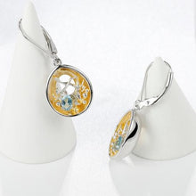 Load image into Gallery viewer, Beautiful artisan made light blue topaz, silver and gold earrings as a gift for you or a loved one. Main Stone: Topaz. Metals Type: 925 Sterling Silver and Gold Plated. Earring Type: Drop Earrings.
