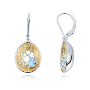 Beautiful artisan made light blue topaz, silver and gold earrings as a gift for you or a loved one. Main Stone: Topaz. Metals Type: 925 Sterling Silver and Gold Plated. Earring Type: Drop Earrings.