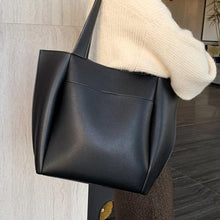 Load image into Gallery viewer, Black leather shoulder bag for you to take anywhere you go. Perfect for work. The leather shoulder bag even has a cell phone pocket. Main Material: PU Leather. Closure Type: Hasp. Bag size: 12.9&quot; H x 11.8&quot; W x 4.72&quot;D  (33 cm H x 30 cm D x 12 cm D). Strap size: 12.9 inches H (33cm H). Free shipping. 
