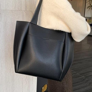 Black leather shoulder bag for you to take anywhere you go. Perfect for work. The leather shoulder bag even has a cell phone pocket. Main Material: PU Leather. Closure Type: Hasp. Bag size: 12.9" H x 11.8" W x 4.72"D  (33 cm H x 30 cm D x 12 cm D). Strap size: 12.9 inches H (33cm H). Free shipping. 