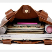 Load image into Gallery viewer, Brown leather shoulder bag for you to take anywhere you go. Perfect for work. The leather shoulder bag even has a cell phone pocket. Main Material: PU Leather. Closure Type: Hasp. Bag size: 12.9&quot; H x 11.8&quot; W x 4.72&quot;D  (33 cm H x 30 cm D x 12 cm D). Strap size: 12.9 inches H (33cm H). Free shipping. 
