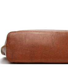 Load image into Gallery viewer, Large brown leather designer shoulder bag for you to take anywhere you go. Perfect for work. The leather shoulder bag even has a cell phone pocket. Main Material: PU Leather. Closure Type: Hasp. Bag size: 12.9&quot; H x 11.8&quot; W x 4.72&quot;D  (33 cm H x 30 cm D x 12 cm D). Strap size: 12.9 inches H (33cm H). Free shipping. 
