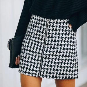 Cute black and white checker mini skirt. Material: Cotton and Lycra. Silhouette: Straight. Waistline: Empire. Pattern Type: Plaid. Dress Length: Above Knee, Mini. Free shipping.