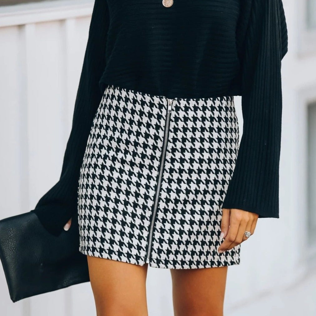 Cute black and white checker skirt. Material: Cotton and Lycra. Silhouette: Straight. Waistline: Empire. Pattern Type: Plaid. Dress Length: Above Knee, Mini. Free shipping.