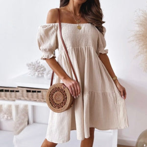 Stylish beige summer dress. This sweet beach or party dress comes in white, black, khaki and green. Silhouette: A-Line. Sleeve Style: Puff Sleeve. Decoration: Shirring. Dress Length: Above Knee, Mini. 