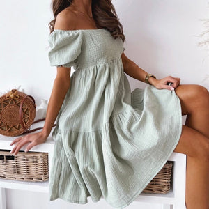 Stylish green sundress. This sweet beach or party dress comes in white, black, khaki and green. Silhouette: A-Line. Sleeve Style: Puff Sleeve. Decoration: Shirring. Dress Length: Above Knee, Mini. 