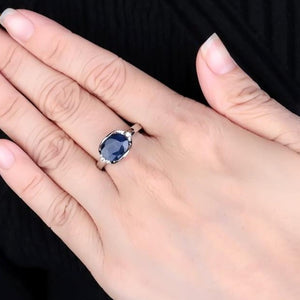 Beautiful Blue Sapphire 925 sterling silver oval ring. Great gift for the one you love. Metal: Silver. Metal Stamp: 925 Sterling. Main Stone: Blue Sapphire. Side Stone: White Cubic Zirconia. Setting Type: Prong Setting. 